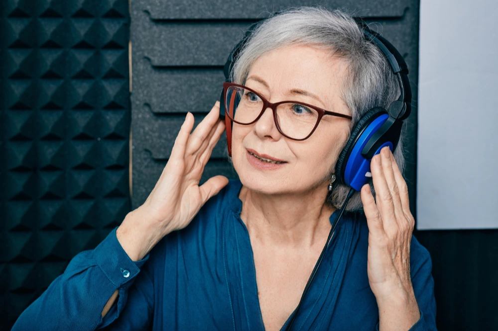 Alpha Hearing woman taking hearing test