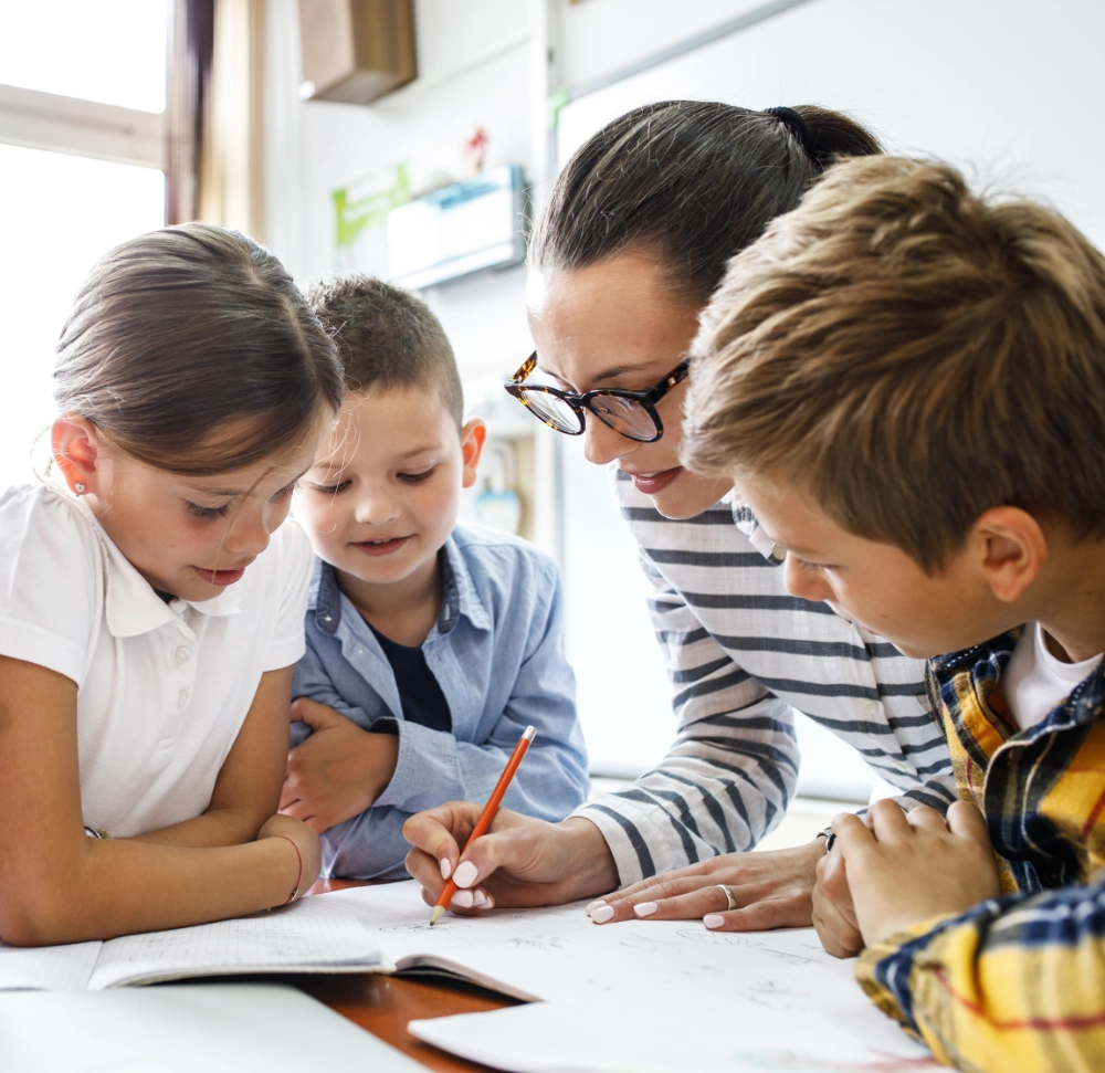 children with teacher at school