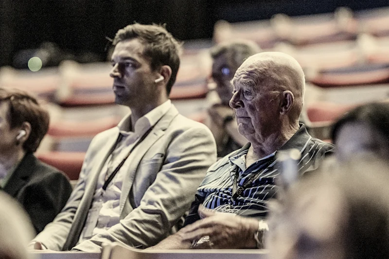 Article 10 “I was actually in tears.” Daryl Holmes, right, hears music clearly for the first time in a long time with special new technology at the Sydney Opera House. Credit: Courtesy Hearing Australia, digitally tinted